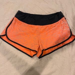 Orange, gray, and black BCG running/athletic shorts